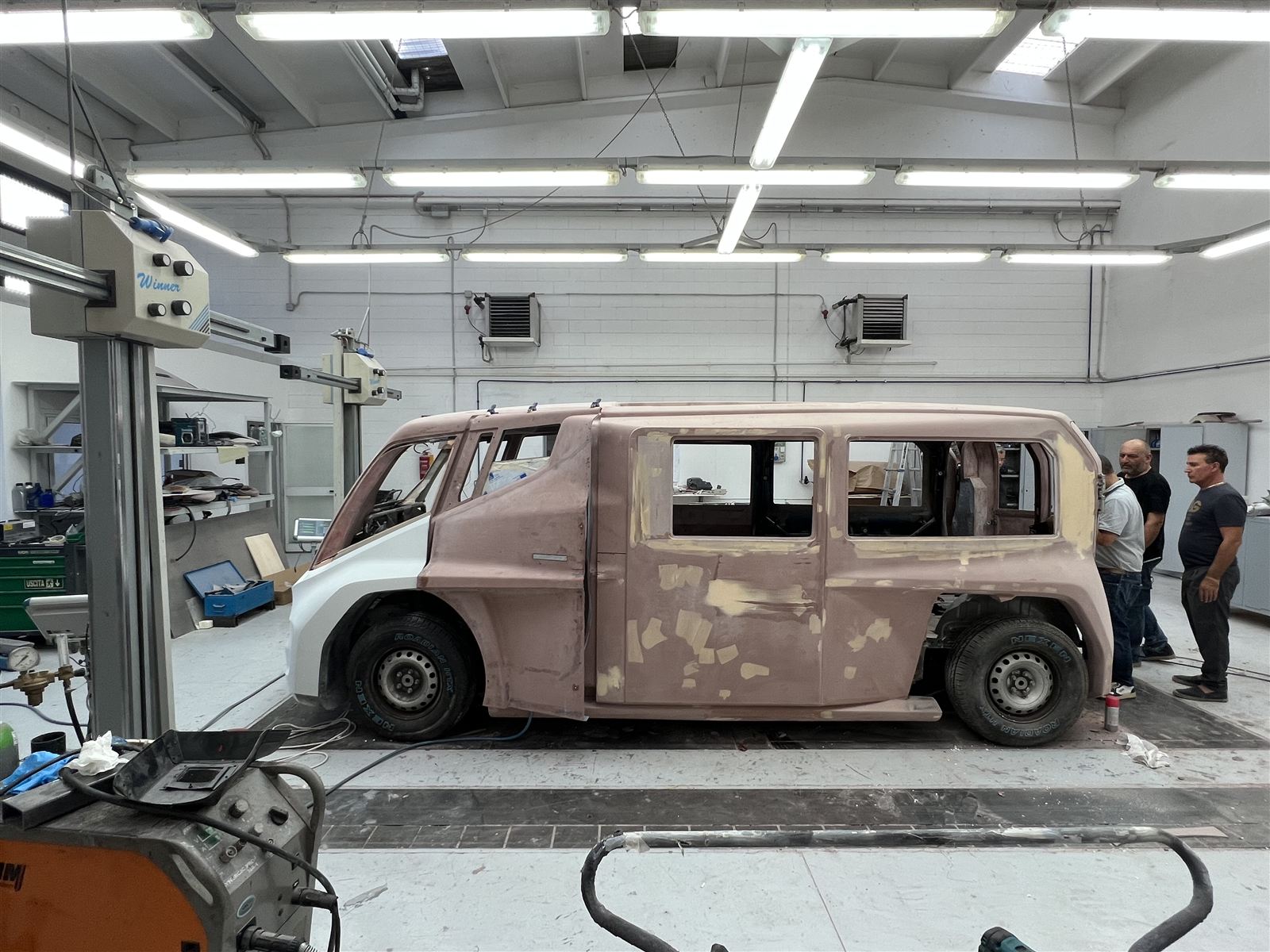Body panels being fitted to the frame